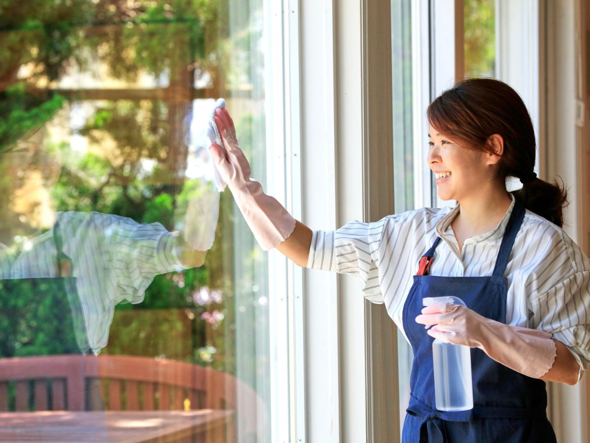 a woman cleaning a window